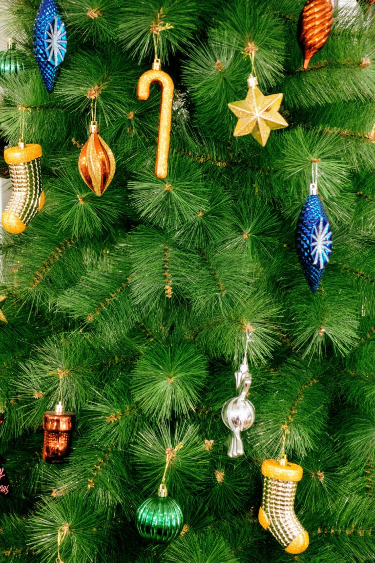 Close-up of a festive Christmas tree adorned with colorful ornaments and decorations.